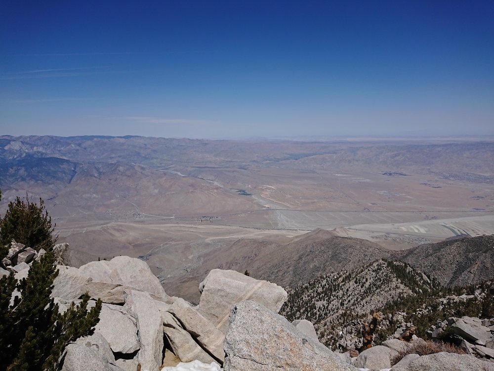 Looking down at the flat desert.