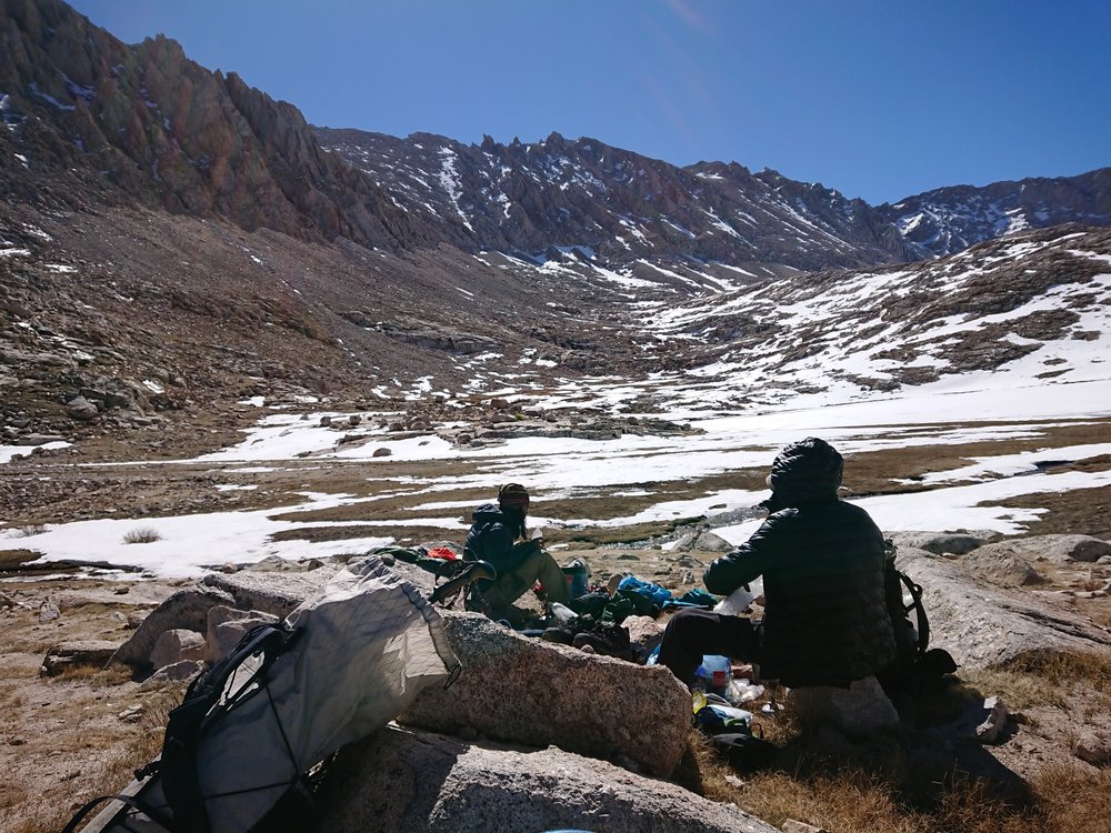 Taking a break at Guitar Lake while looking back at Mt Whitney