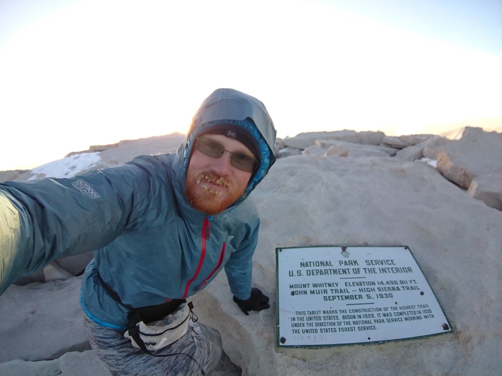 Frozen selfie with the plaque at the summit