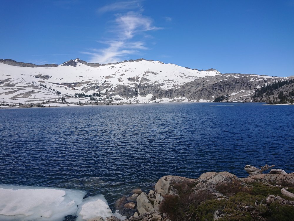 Lake Aloha is beautiful with the snow covered mountains as a backdrop