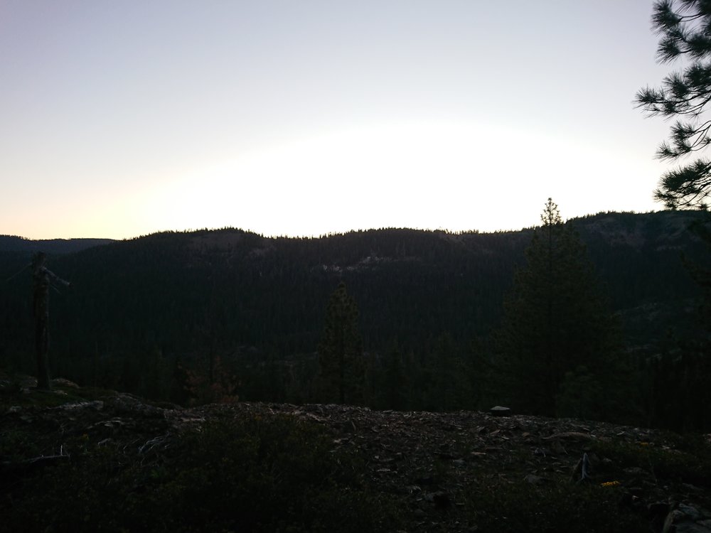 The sun almost peeking over the mountains