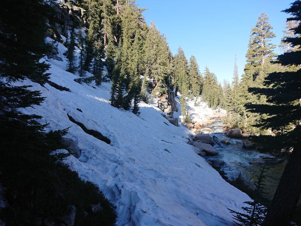 Very steep difficult snow slope to traverse with runoff straight into a creek