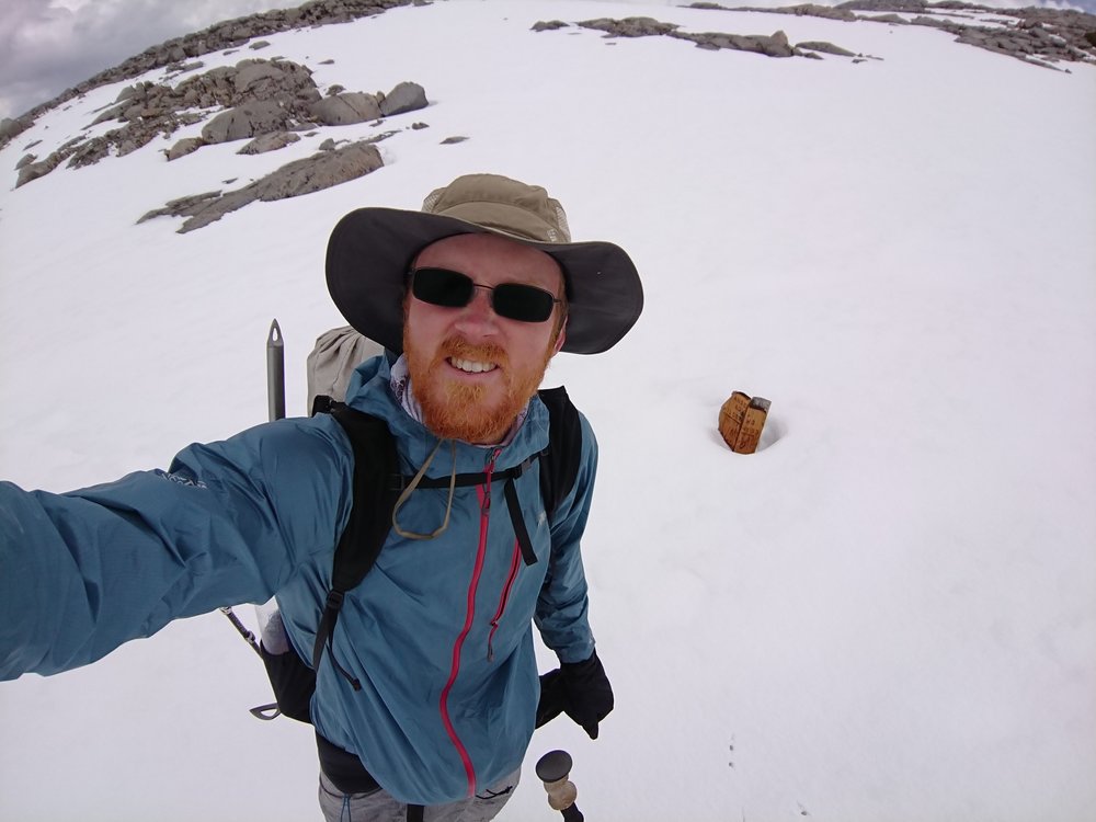 The sign at the top of Donohue Pass reveals how much snow there is