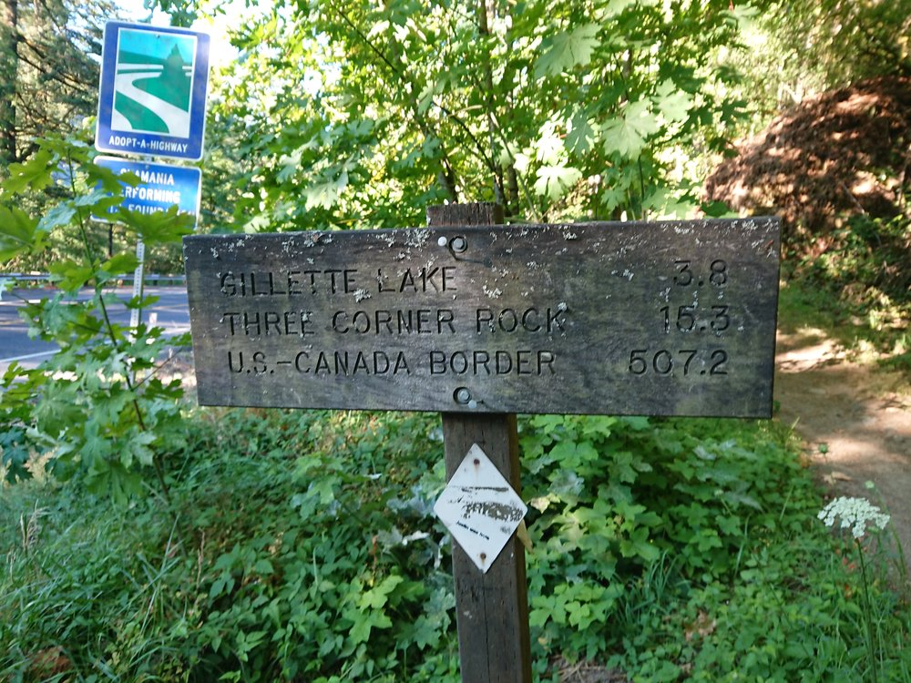 Sign reclining m reminding me that there are still some miles to go